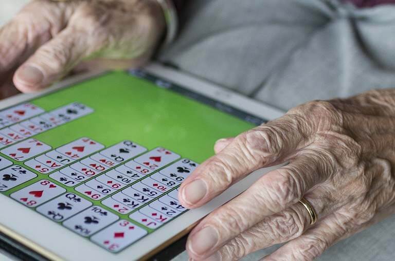 an older adult using an iPad