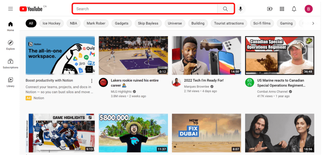 Youtube home page with Search bar highlighted in red to show where to search for a video.