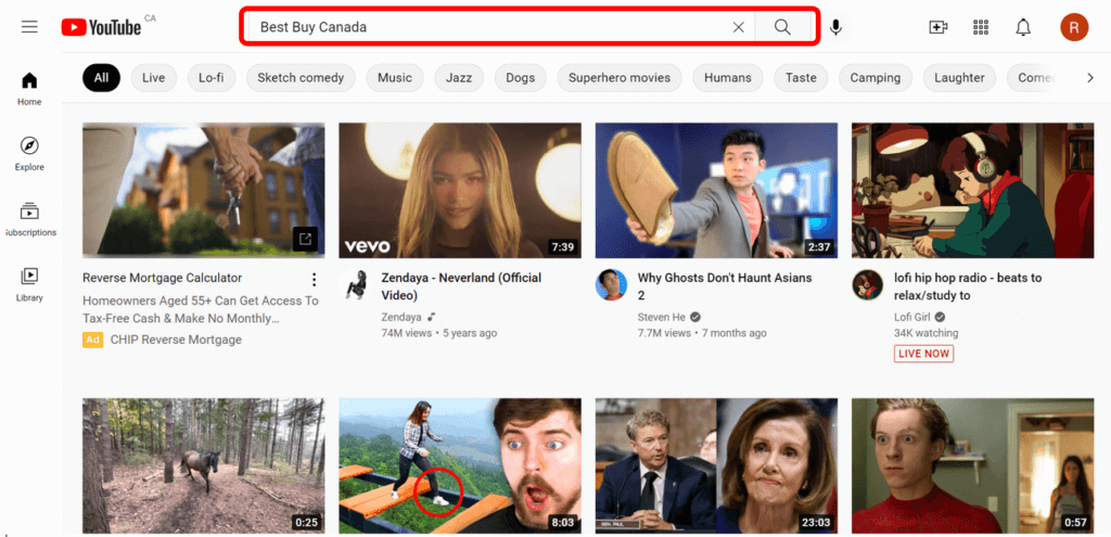 Youtube home screen with Best Buy typed into search bar to show how to search for a Youtube channel.
