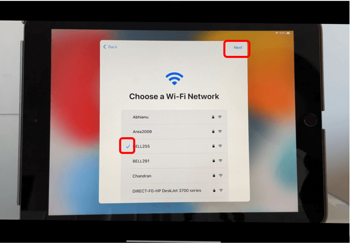 iPad Choose a Wi-Fi network screen with Next button circled in red