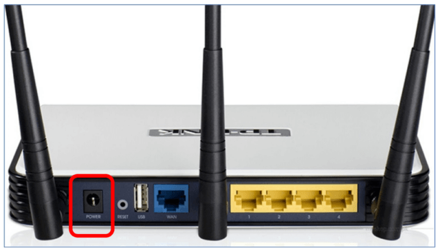Wireless router with power socket highlighted to show where power cord plugs into.