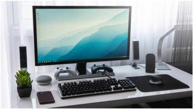 computer on desk with accessories
